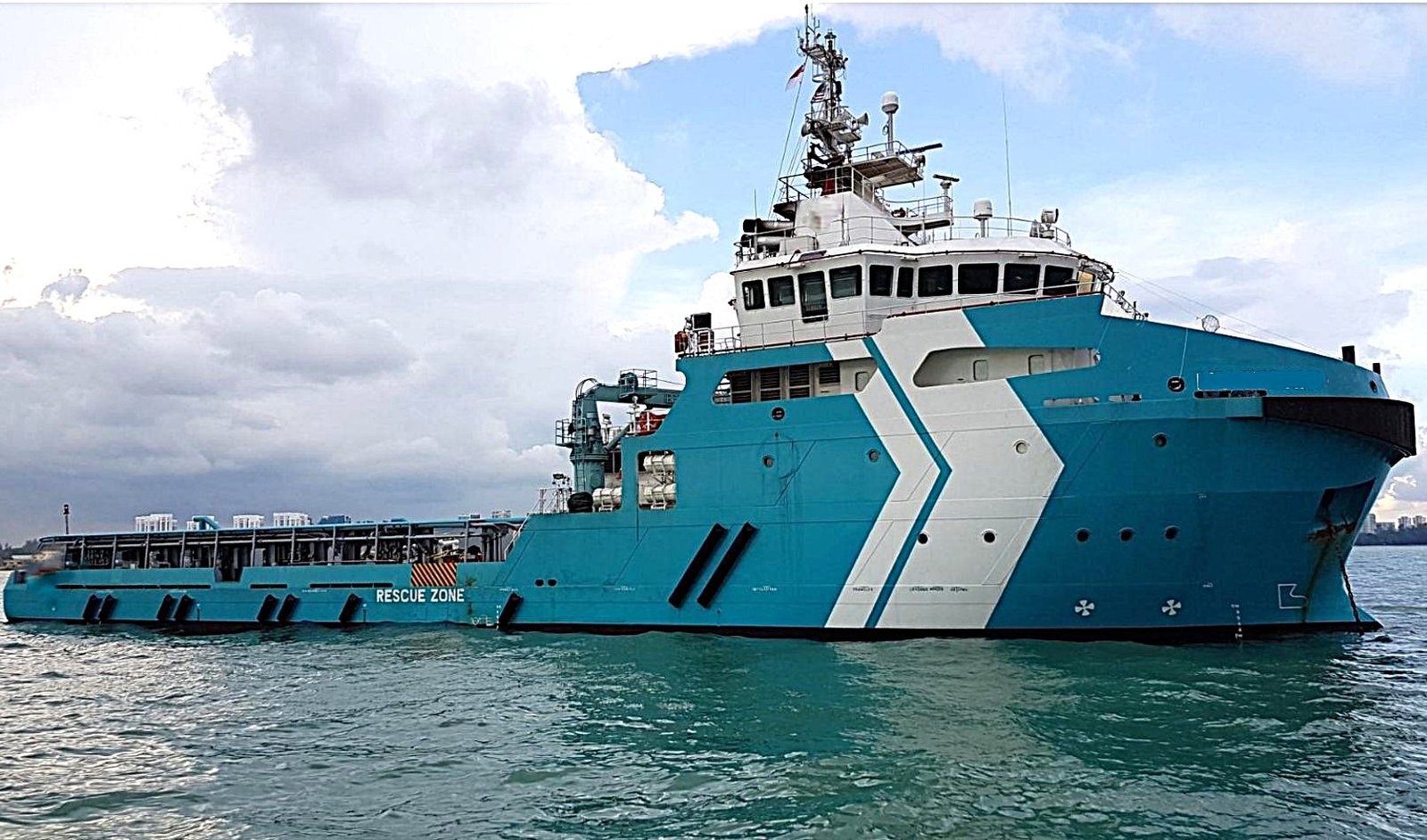 Anchor Handling Tug Supply vessel safely anchored midstream.