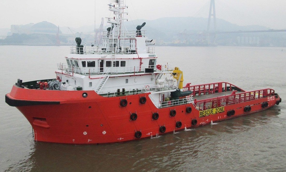 Anchor Handling Tug Supply (AHTS) vessel safely anchored midstream.