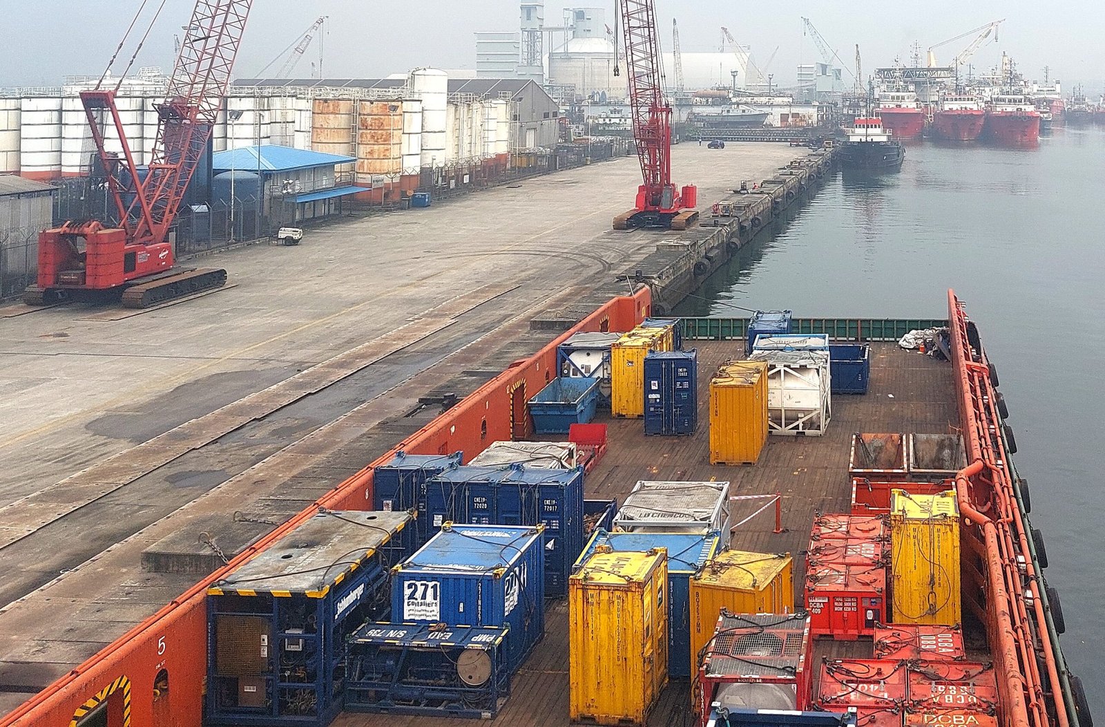 Platform supply vessel with cargo loaded on main deck for delivery offshore