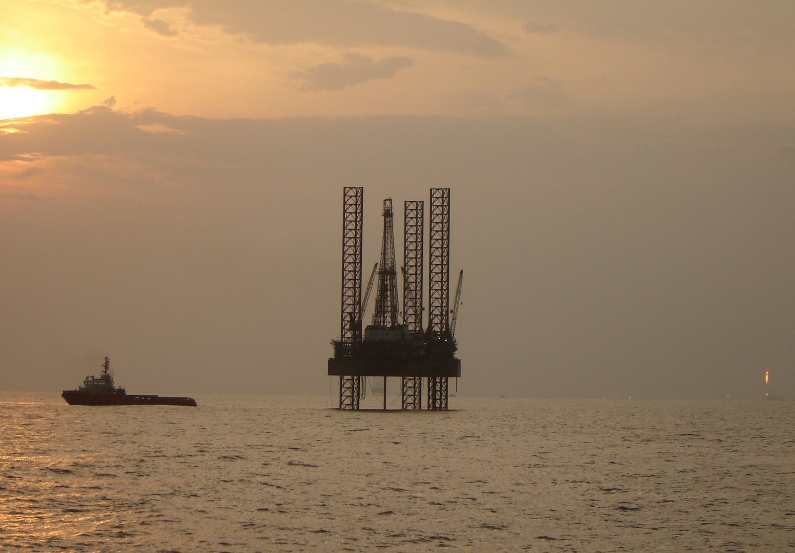 Offshore Support Vessel standing by a Jack-Up rig at an oilfield location