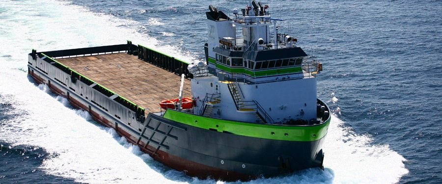 Platform Supply Vessel (PSV) underway to an offshore location, moving at full ahead.